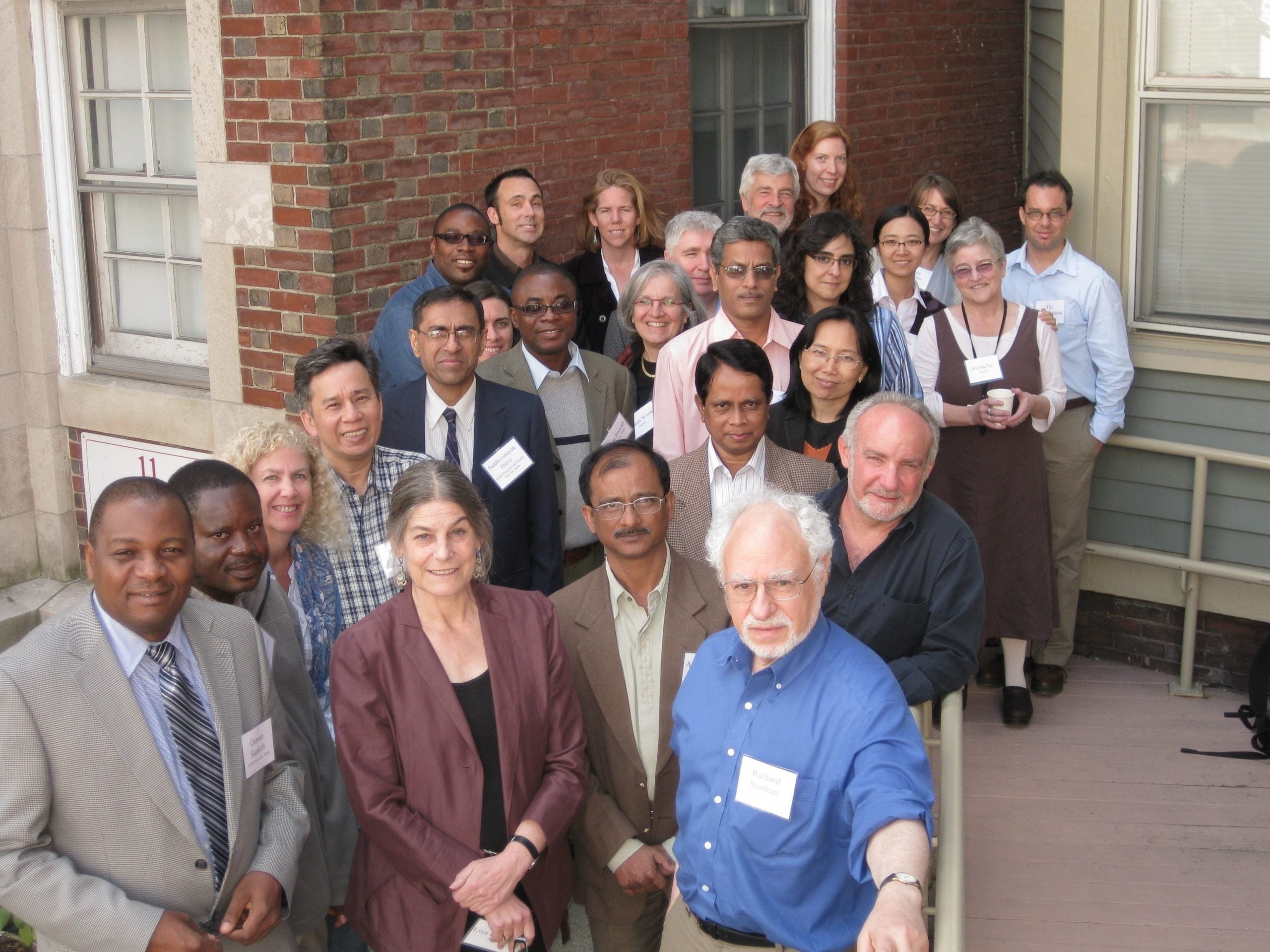 Group of HAALSI researchers gather outside the Pop Center