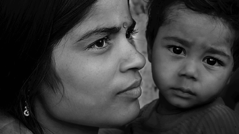 image of an Indian woman and a small child