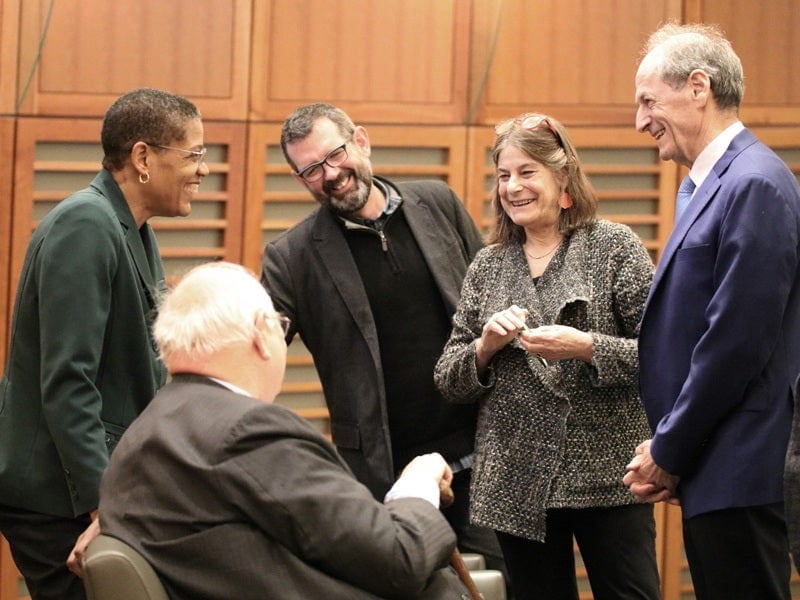 The group of presenters share a laugh