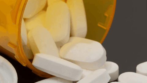 image of pills coming out of pill bottle