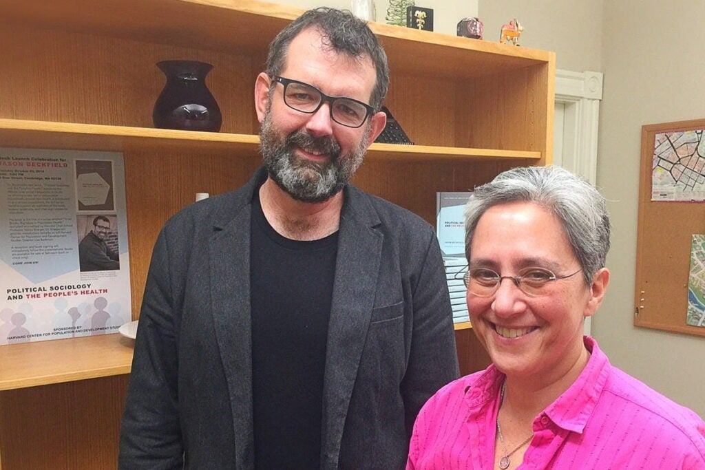 Jason Beckfield and Nancy Krieger stand together