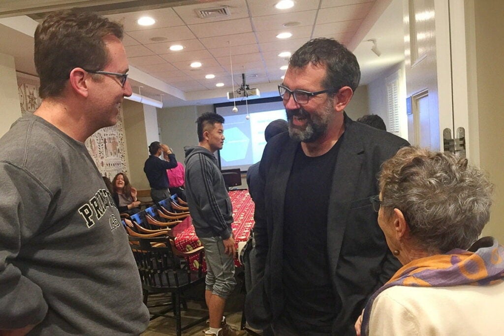 Jason talks to people who attended the book launch in conference room