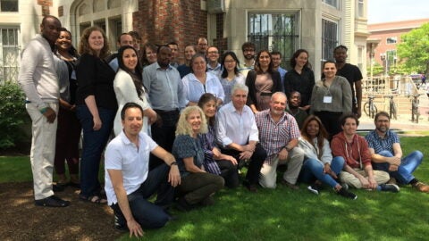 Group of HAALSI researchers gather in front of HCPDS in Cambridge, MA