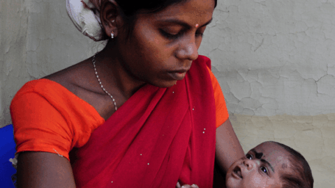 Indian mother holding baby