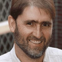 Head shot of Gómez-Olivé