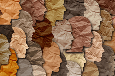 Profiles of people of color in paper cutouts