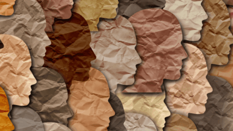 Profiles of people cut out in paper