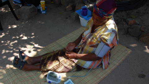 Woman in South Africa having her blood pressure taken