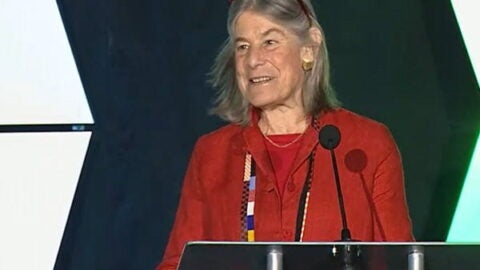 Lisa Berkman at the podium delivering the PAA 2024 presidential address