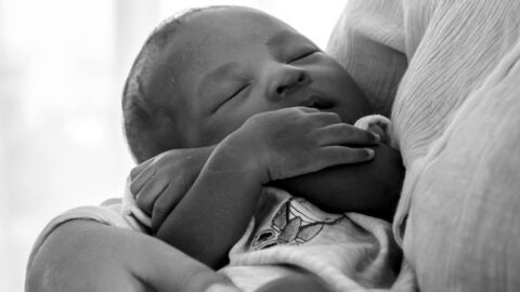 Infant in mother's arms